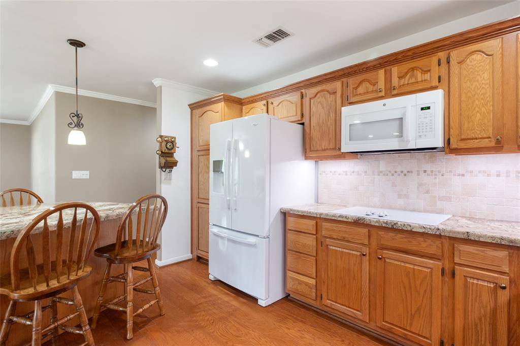 Custom built cabinetry and pantry with roll out shelving