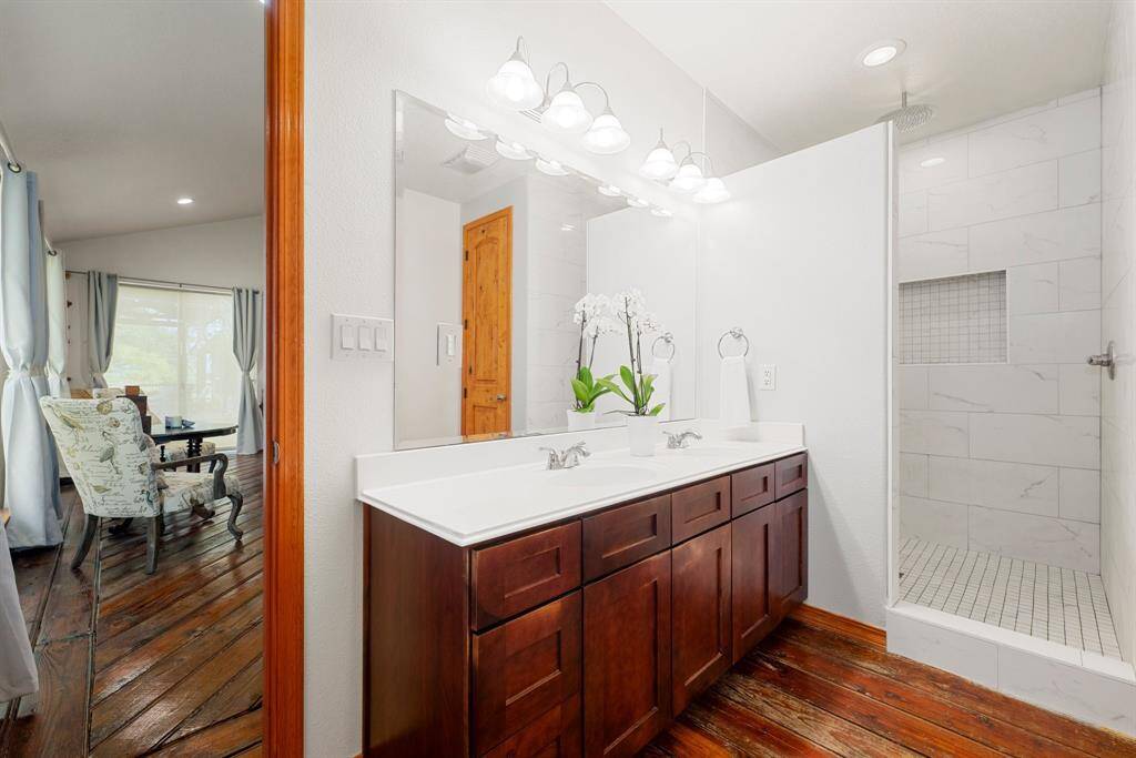 Modern touches combined with old-world charm await you in your primary retreat bathroom. Large walk-in shower with rainfall showerhead will not disappoint.