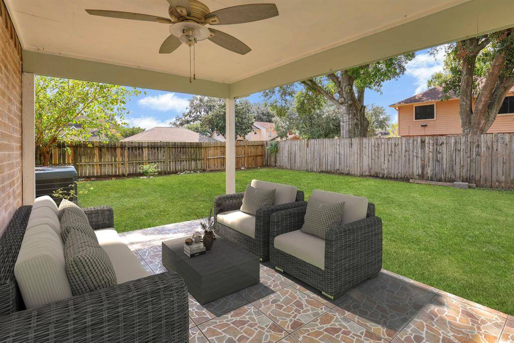 Covered patio with big backyard. Virtually staged.