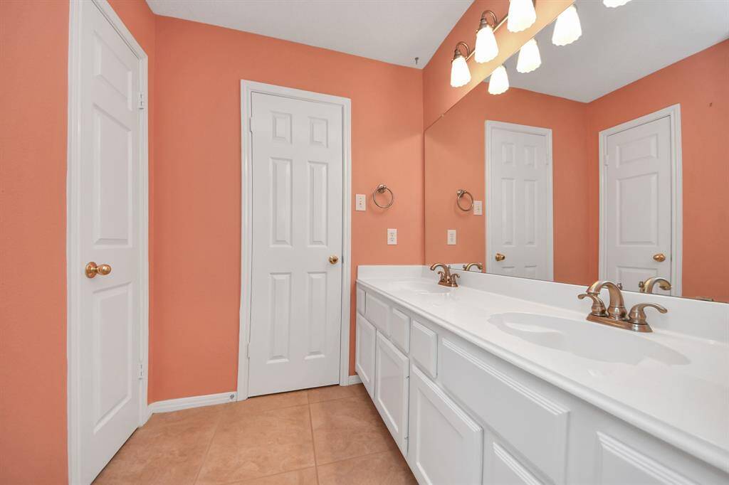 This upstairs bath features double sinks as well
