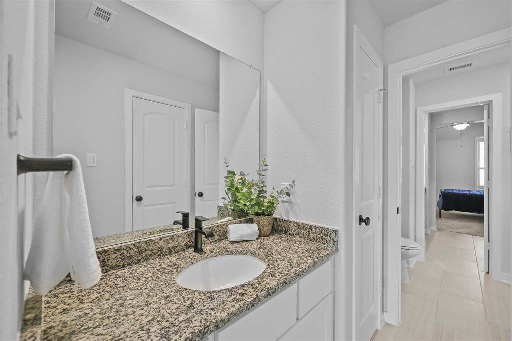Bedroom 3's private sink and vanity.