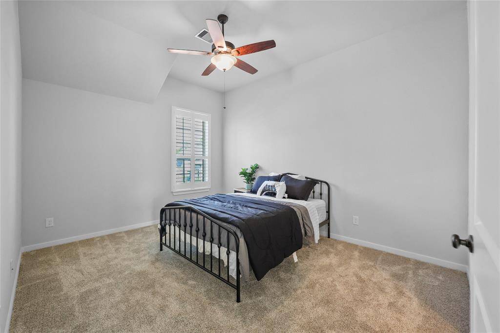 Bedroom 4 with its front-yard view.