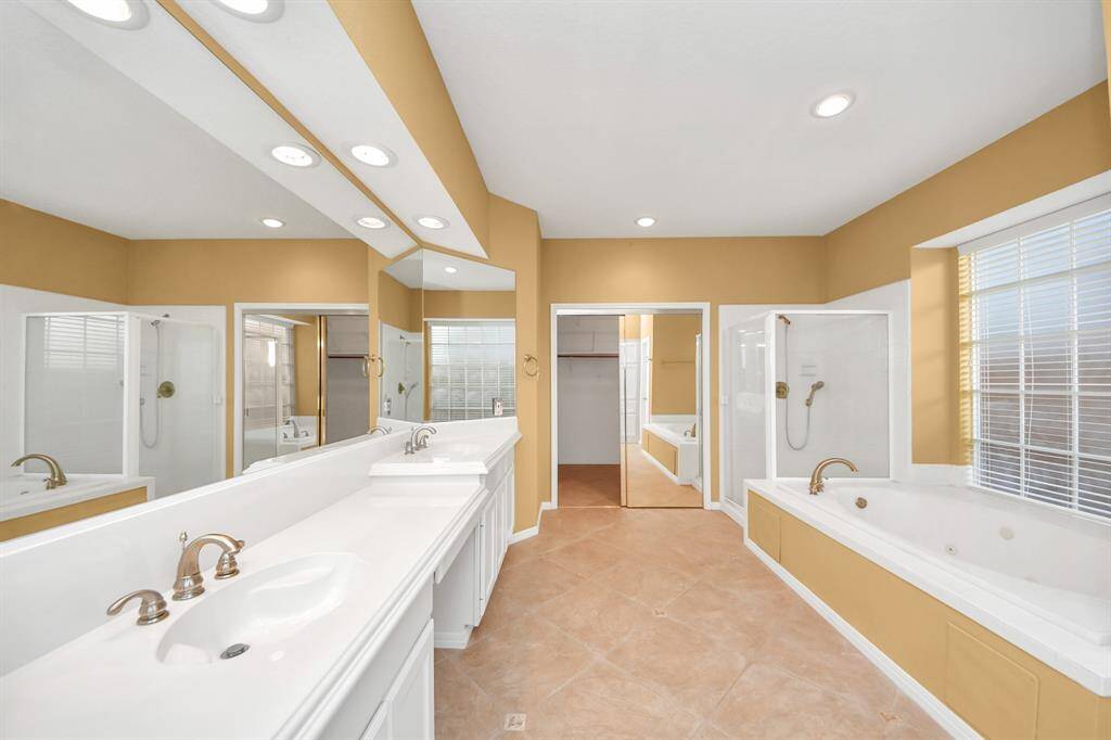 The Primary bath has a separate shower and soaking tub