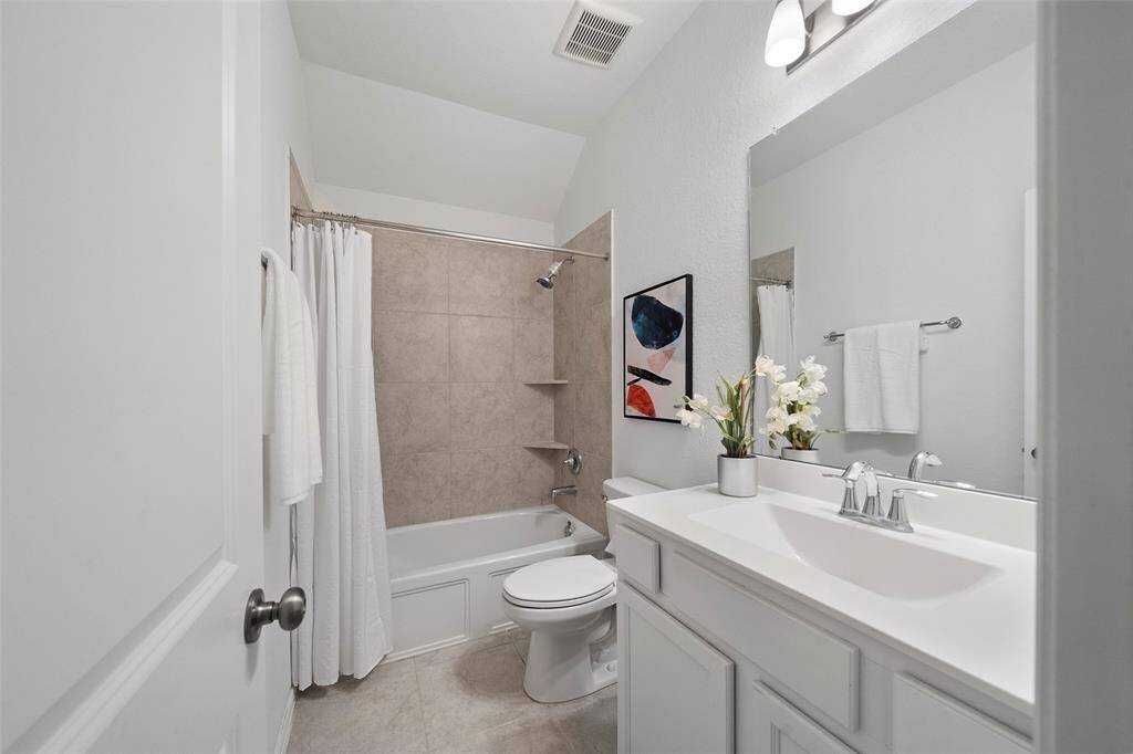 This beautiful second bathroom is convenient and provides ample space.