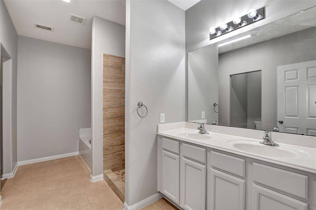 Primary bath has dual sinks, fresh paint, shower was also updated