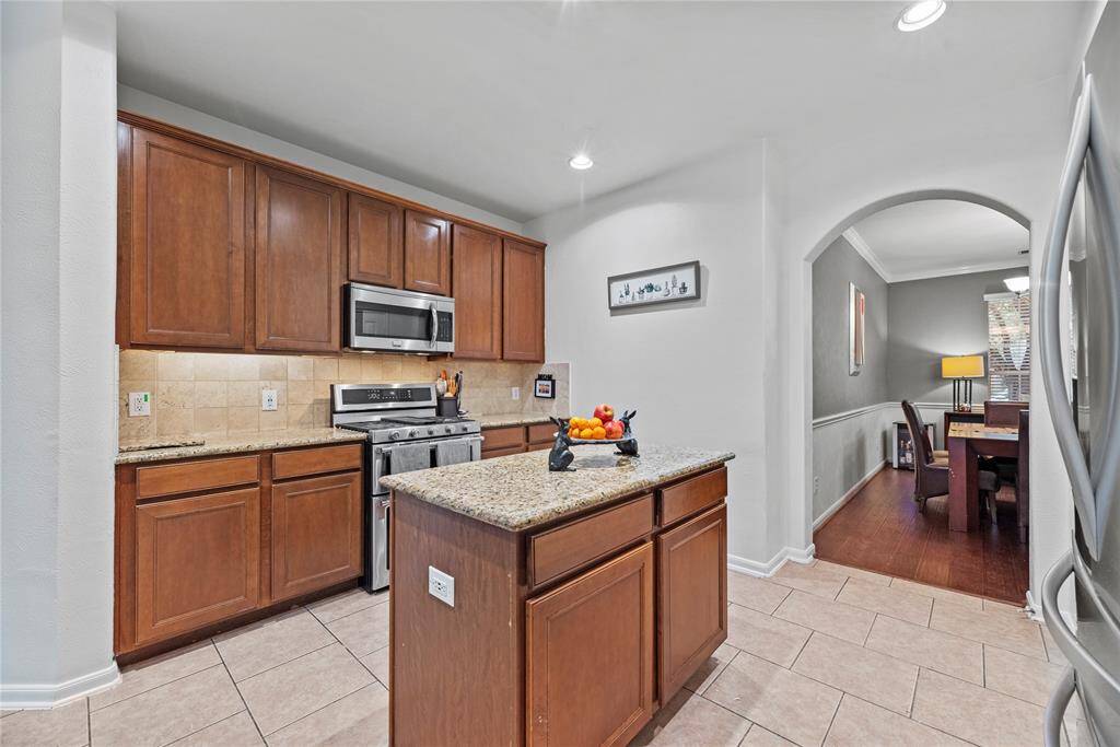 The thoughtfully designed layout of this fourth bedroom allows for natural light to flood the room, creating a warm and welcoming atmosphere.
