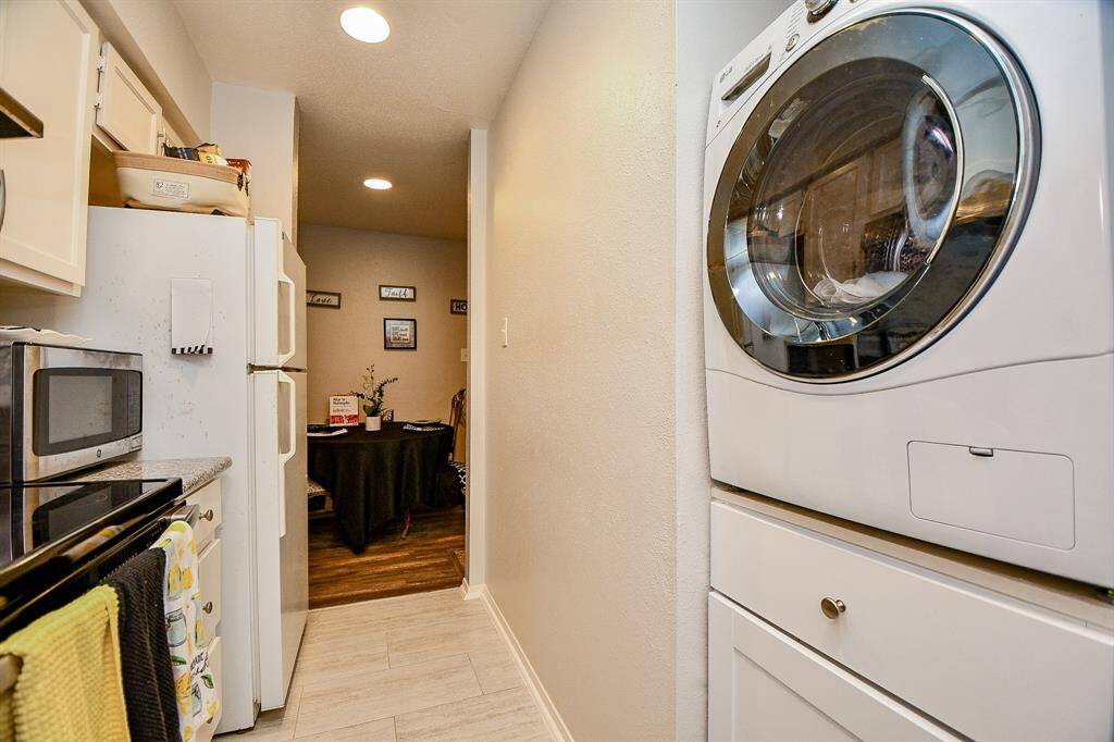 Washer/dryer combo stays with the unit and owners added an underneath storage area!!