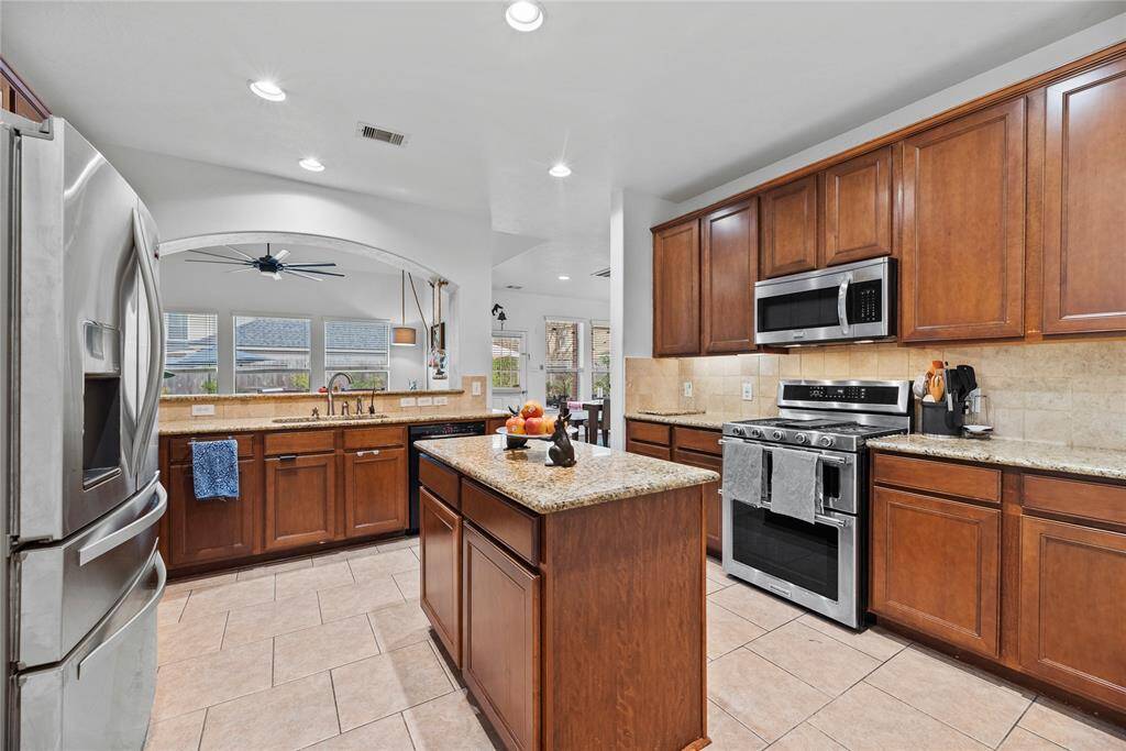 Your upstairs full bath with dual vanities and tons of cabinet storage.