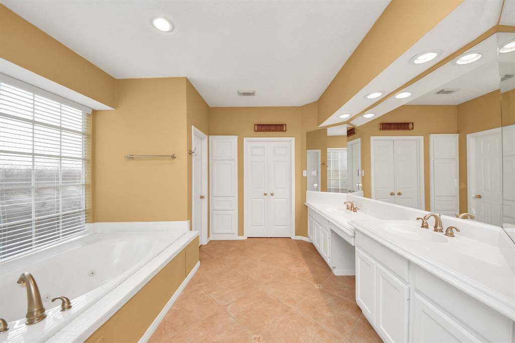 Complete with sitting area, getting ready for the day will be a breeze with the help of this Primary bath.