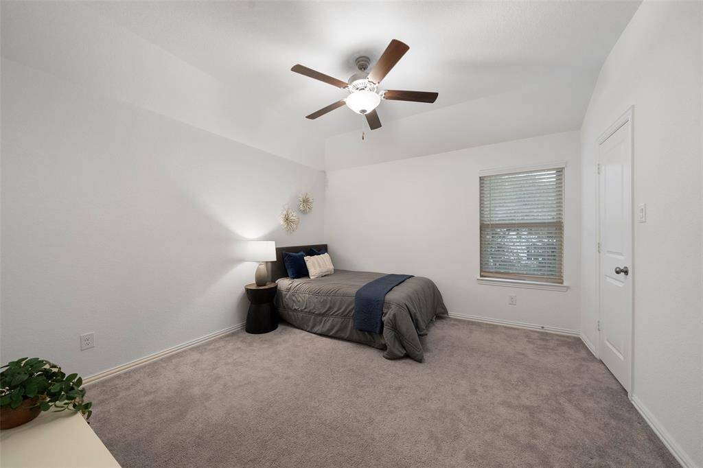 This secondary bedroom offers a comfortable, cozy inviting space with neutral decor!