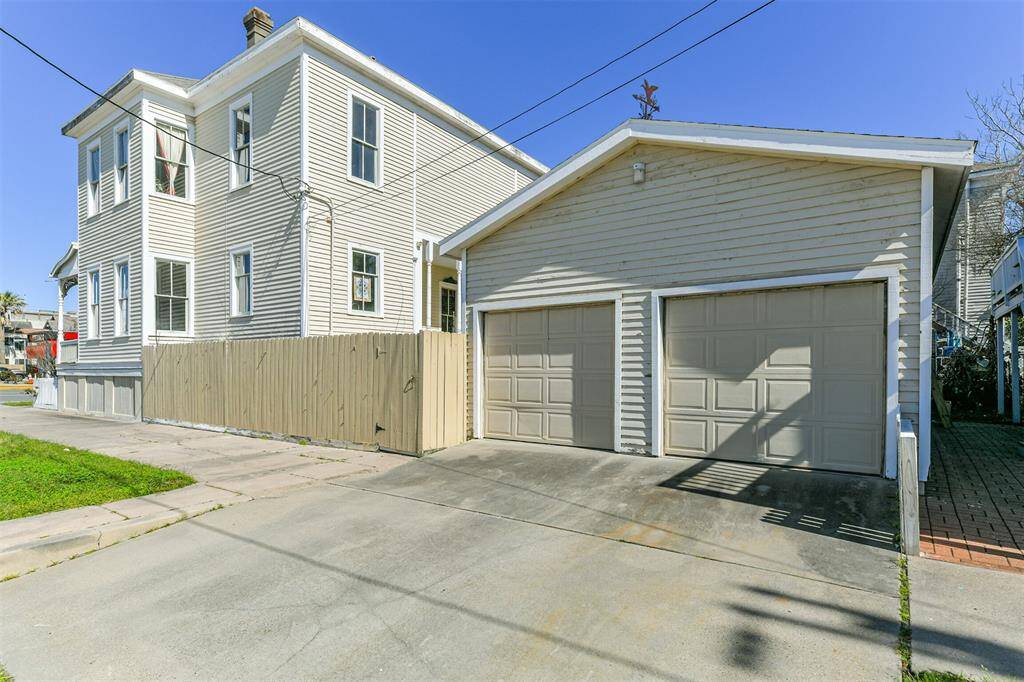 Parking can be difficult in the historic district, but not for this home!  It features a two-car detached garage with a double-wide concrete driveway that provides even more off-street parking space.