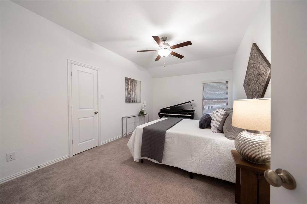 This spacious secondary bedroom offers plenty of room with all neutral decor!