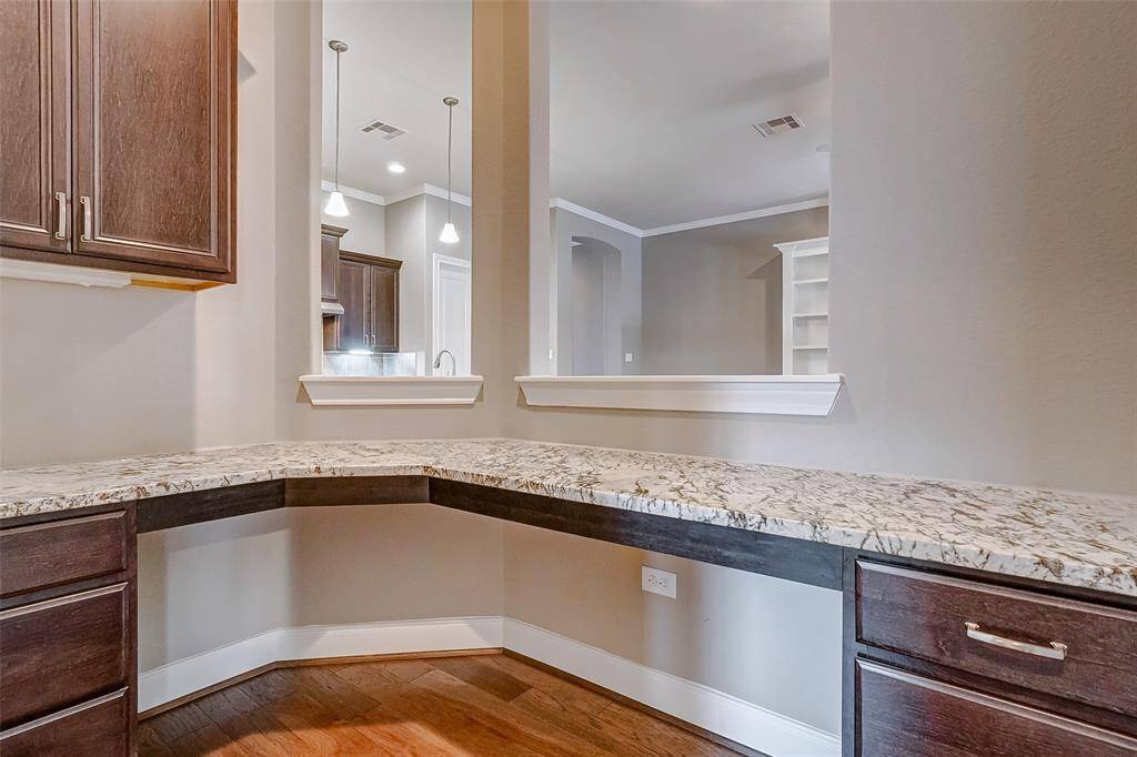 The planning center is a great space for a second office, wine room, or a study area.