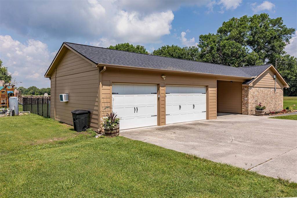 3-car garage with one being a drive thru plus has a/c & heat