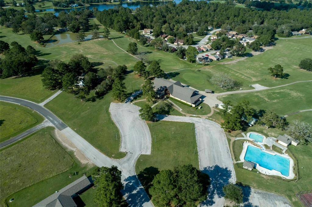Ariel view of Main Club house, 1 of 3 pools, lakes and Golf course views
