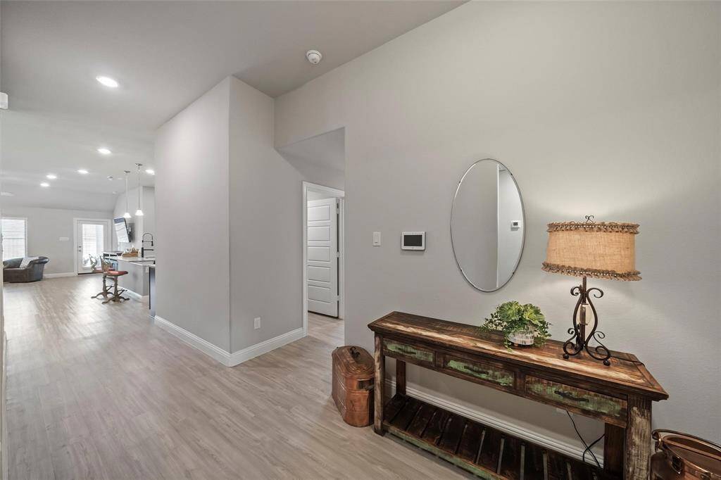 The entry way welcomes you to the perfect open concept floor plan, and the flex space to the right.