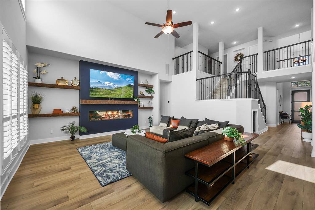 New luxury vinyl plank flooring expanding throughout the main living areas compliment the open staircase w/wrought iron spindles. This vast open view provides a free and connected feeling to the rest of the home.