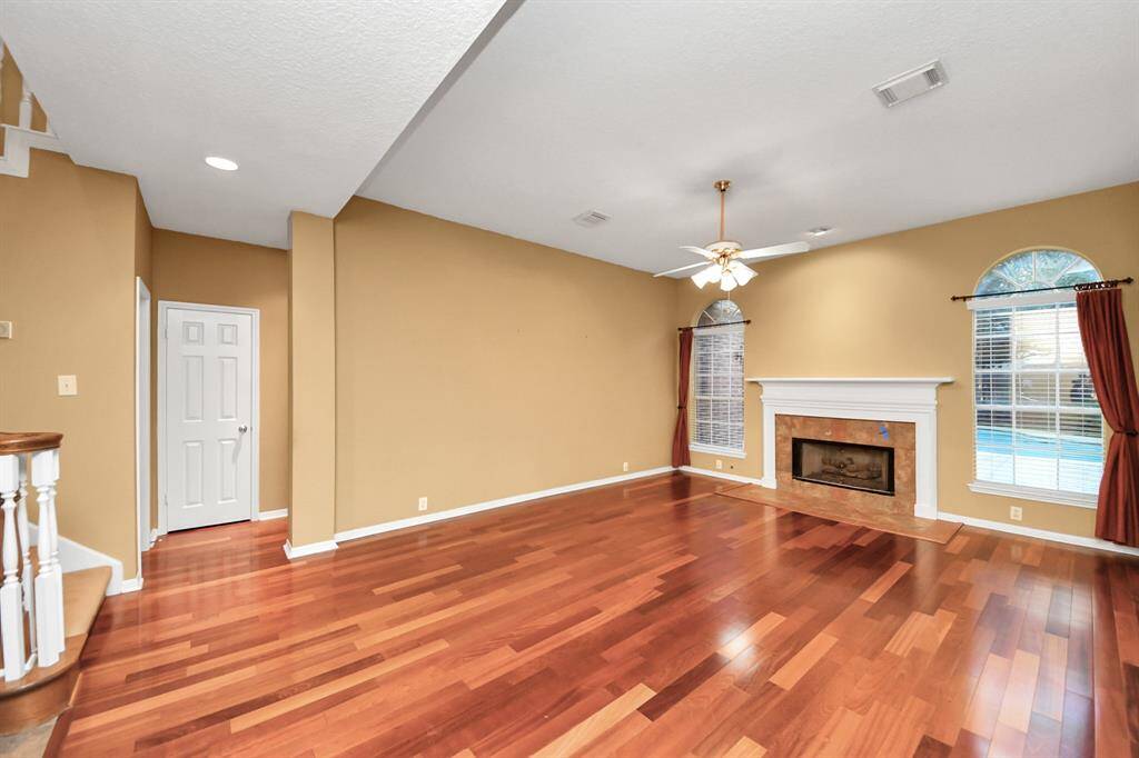 The signature wood floor enhances this large living room