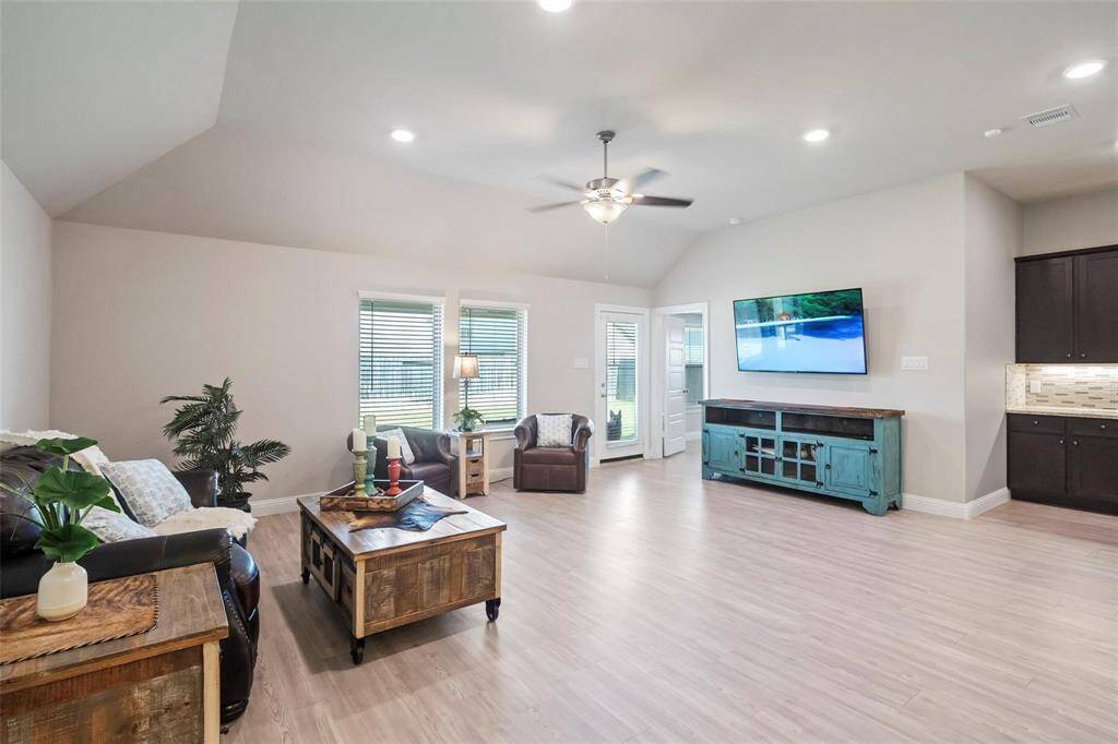 The living area just off of the kitchen is spacious.