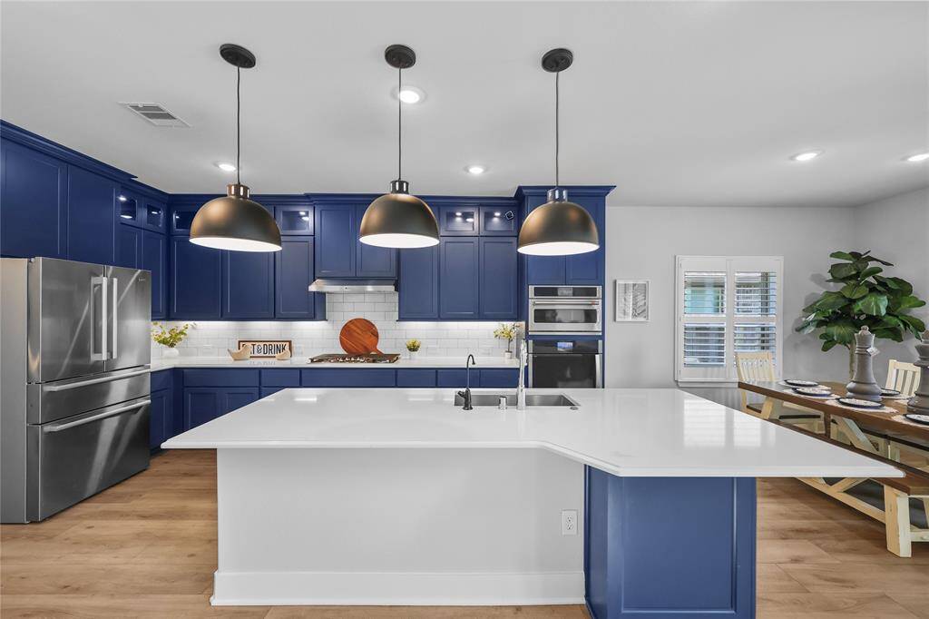 The large kitchen island offers a great place for preparing meals and serving while entertaining. Undercabinet lighting sets the mood for all of your get togethers. On top of the WHOLE HOME WATER FILTRATION SYSTEM, there's also a triple filter under the sink for drinking water.