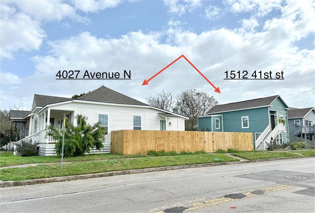 View of both houses on the same lot. There is a fenced in backyard for the white house. Feels completely seperate from the duplex.