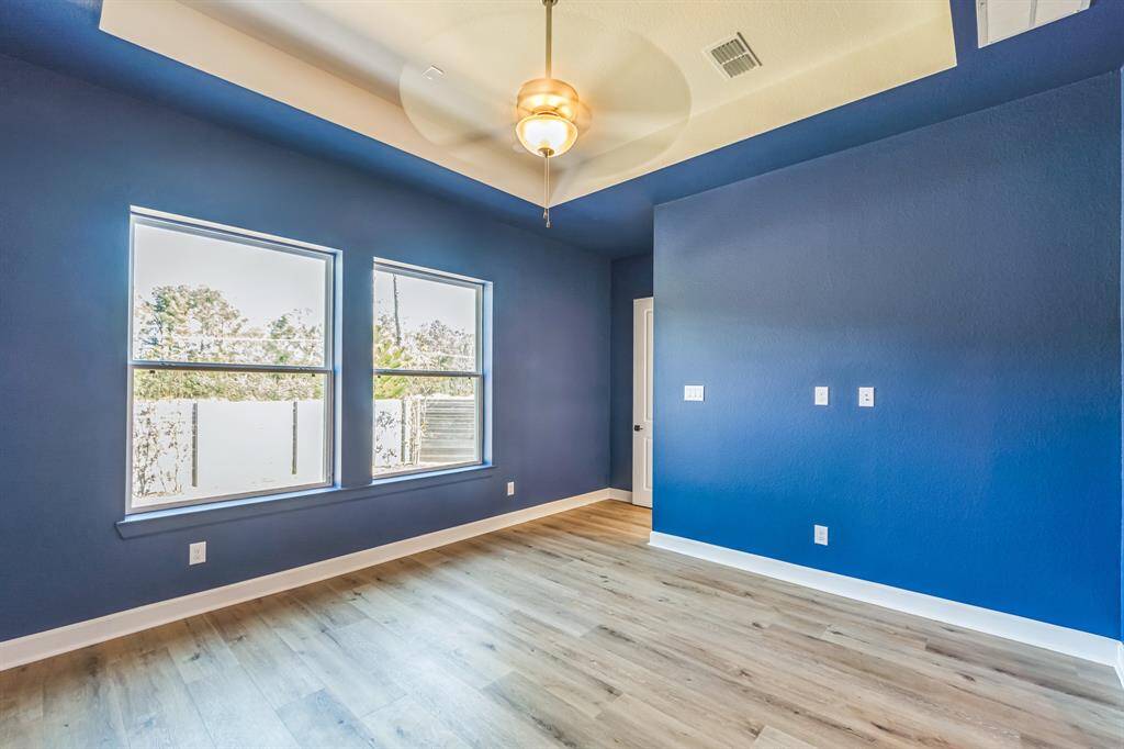 master bedroom with plenty of windows