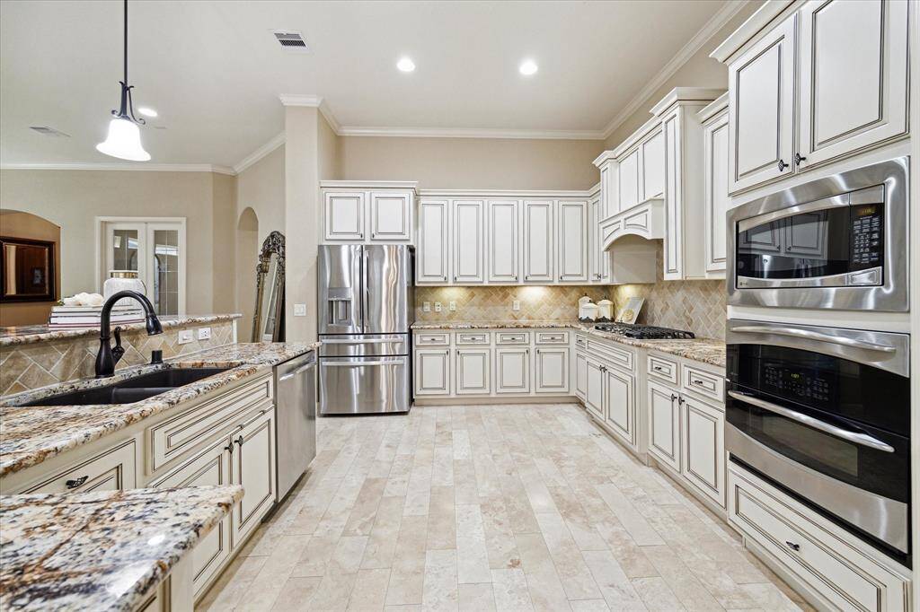 Enjoy cooking and baking with double ovens in your spacious kitchen.