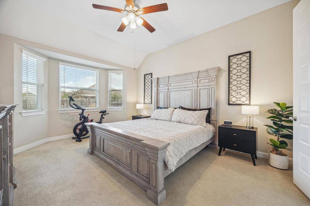 Oversized primary bedroom with beautiful bay windows