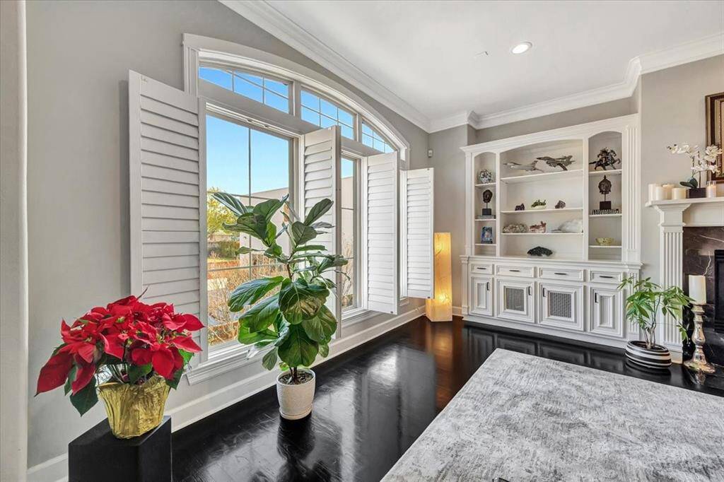 The main floor is bathed in natural light, thanks to an abundance of windows that create a bright and welcoming atmosphere