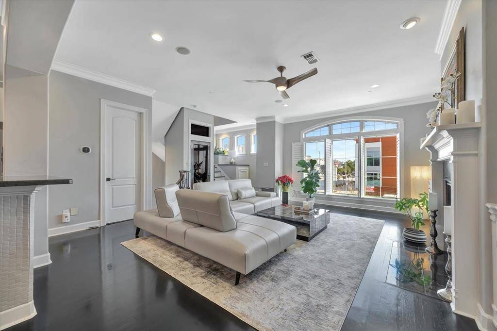 The main floor has wood flooring throughout most of the area with the exception of the powder bath. A central vacuum system throughout the home adds convenience and efficiency, while an automatic dustpan on the main floor makes cleaning a breeze.