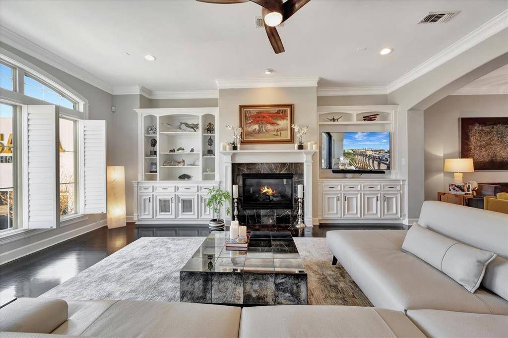 This spacious family room easily accommodates large furniture, making it the perfect space for gatherings, game days, and holiday celebrations.