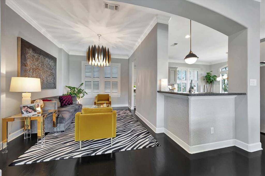 Just off the family room, you'll find a formal dining area with an elegant arched entry, perfect for hosting special occasions.
