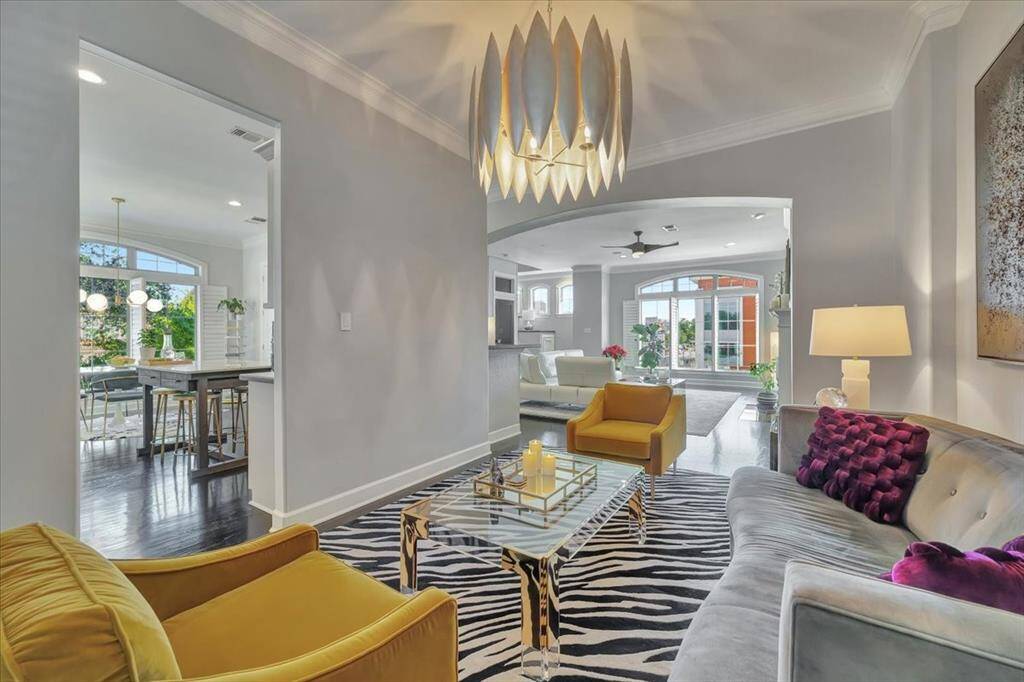 Throughout the home, exquisite designer lighting enhances each space, adding a touch of elegance and warmth.