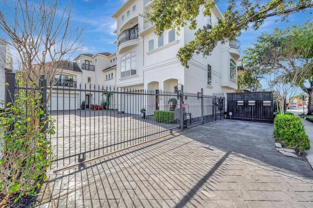 The small quaint 3 home gated complex offers an extra communal parking space.