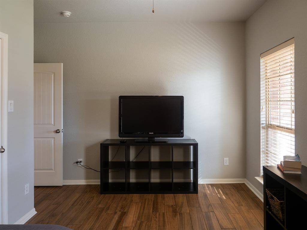 Secondary bedroomNew tile wood flooring