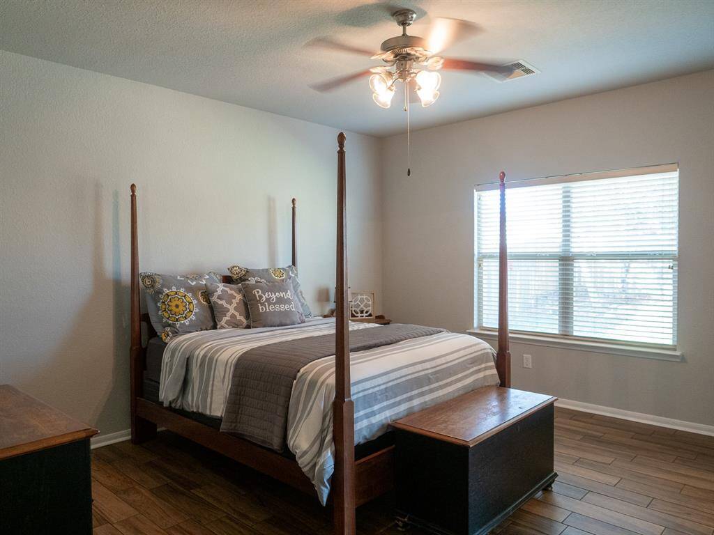 Primary suite, large and can hold a King size bedroom set.New tile wood flooring