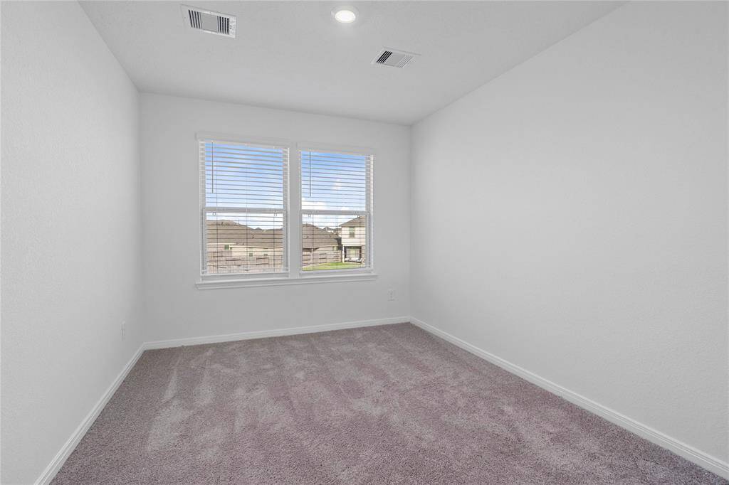 Come upstairs and enjoy a day of leisure in this fabulous loft!!! This is the perfect hangout spot or adult game room, this space features plush carpet, high ceiling, recessed lighting, large windows with blinds, and custom paint!