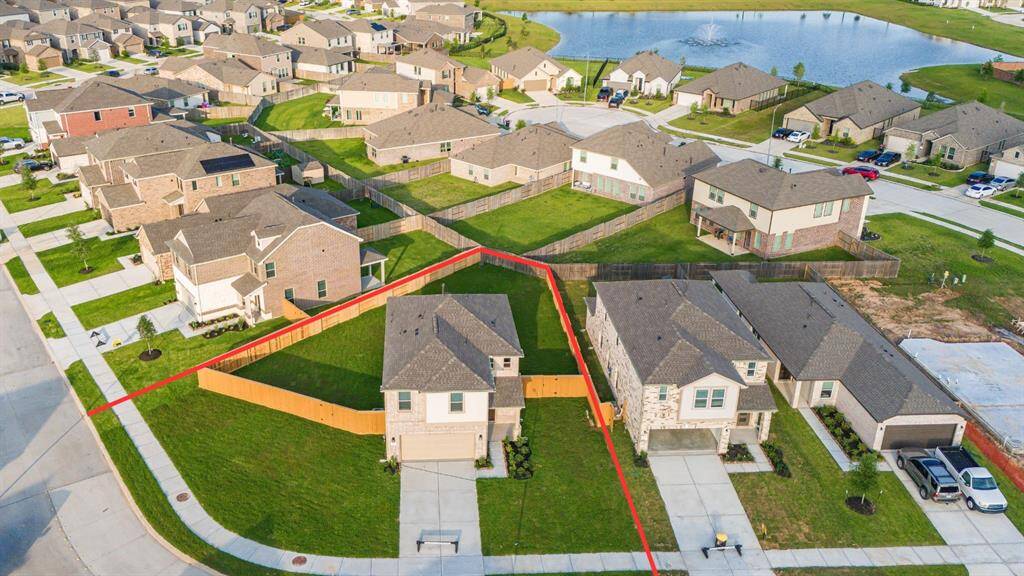 Amazing aerial shot of this gorgeous KB Home home situated on an OVERSIZED CORNER LOT in the sought after community of Marvida.