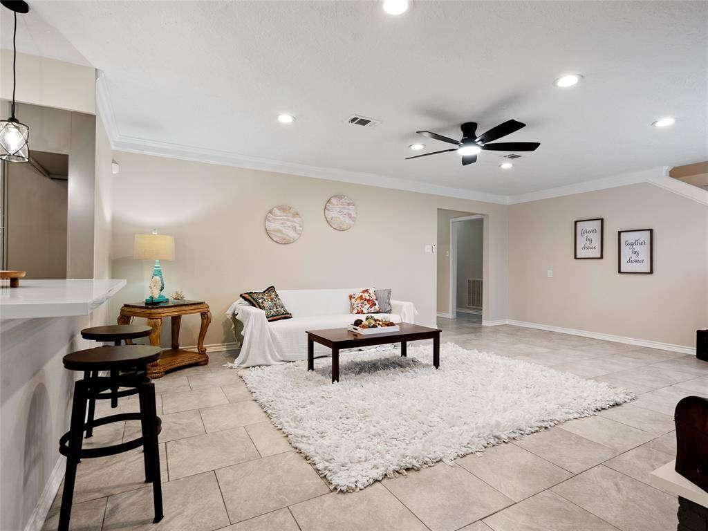 The family room is huge & is open to the kitchen