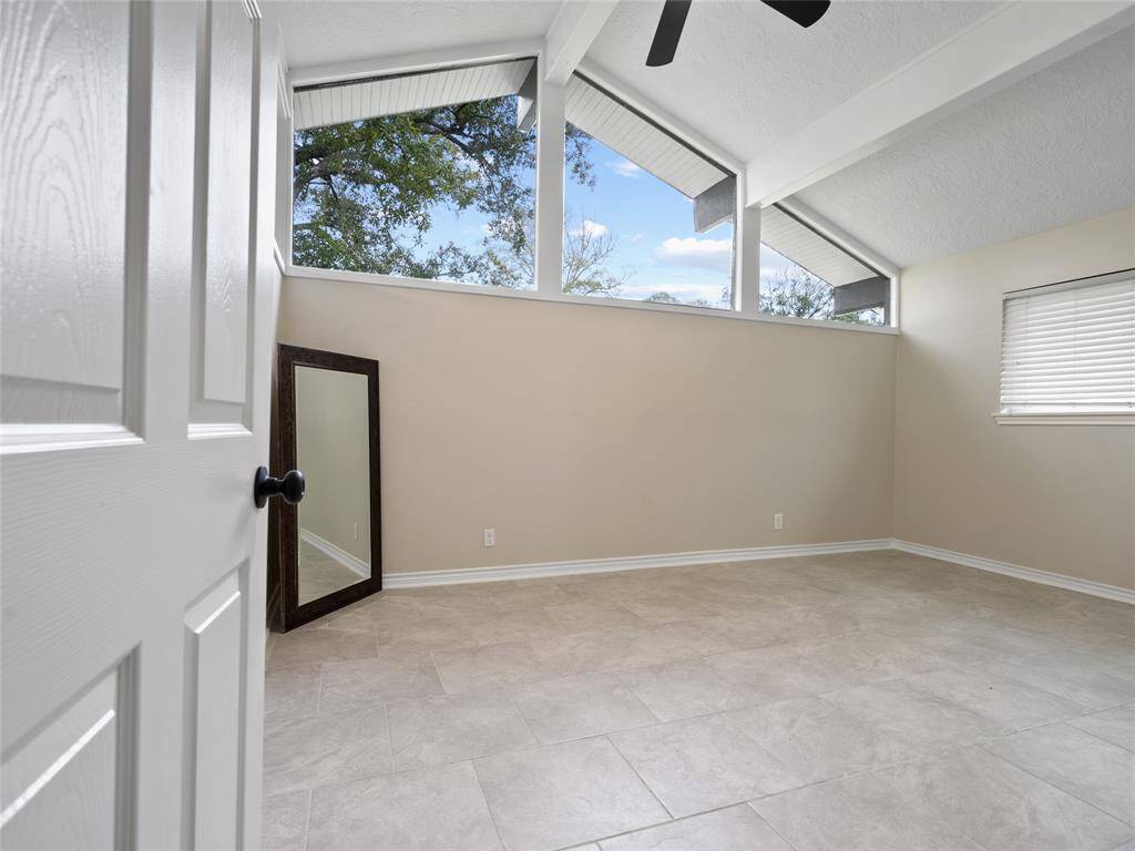 The primary bedroom with its fantastic windows