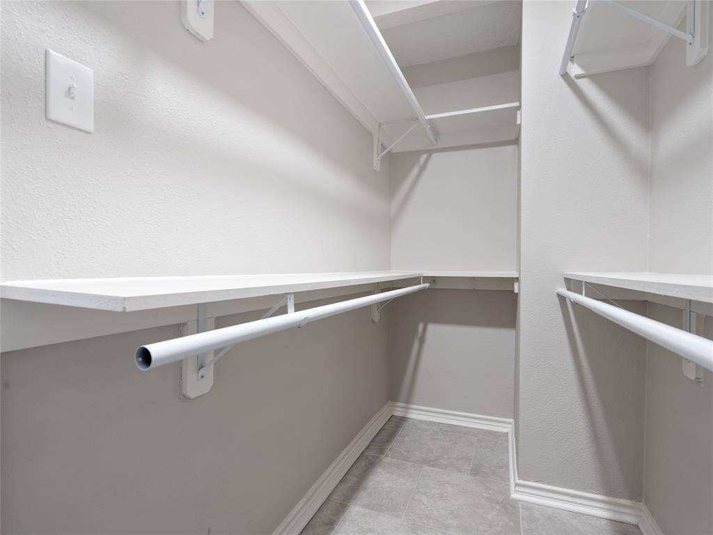 The walk-in closet in the primary bedroom