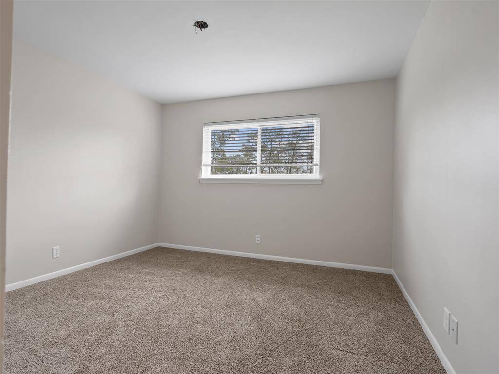 One of the three upstairs secondary bedrooms