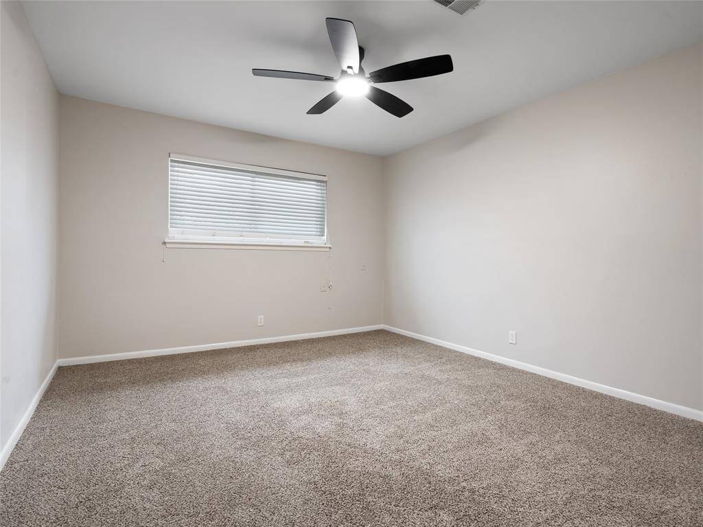 The last of the three upstairs secondary bedrooms