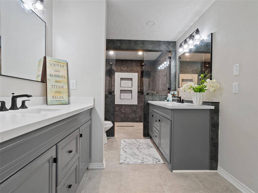 The primary bathroom has been remodeled & updated to provide a spa-like atmosphere
