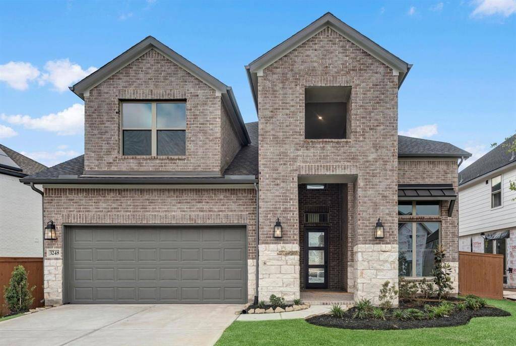 MOVE IN READY!! Westin Homes NEW Construction (Ellington III, Elevation B). Two story. 4 bedrooms. 3.5 baths. Green grass added to enhance photo.