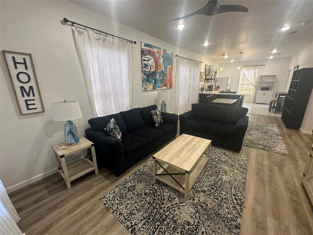 The open concept living room and kitchen makes for a great way to keep the party going and never miss a beat!