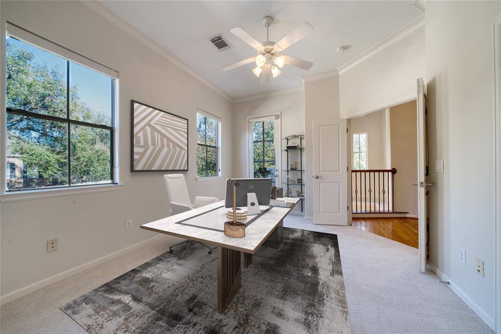 One of the two secondary bedrooms offers a serene retreat, featuring new carpet, its own private balcony, and a full en-suite bath—creating a perfect space for relaxation and privacy.