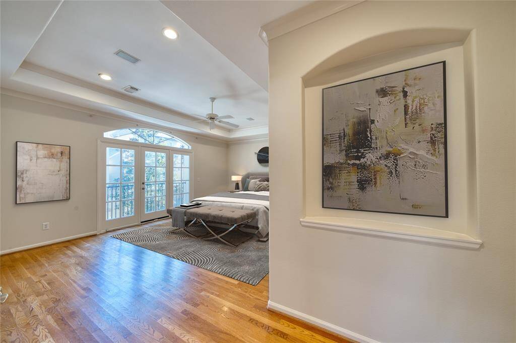Sleek art nook at primary bedroom entrance.