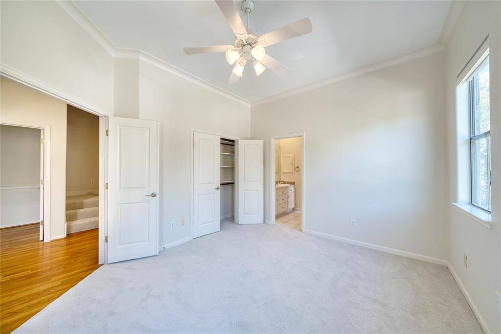 Another view of secondary bedroom with ample space and natural light.
