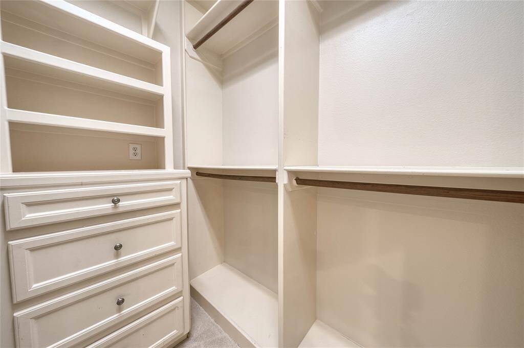 Spacious walk-in closet with ample storage and organization solutions.